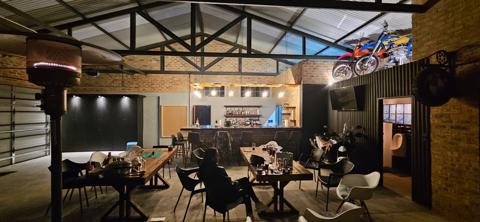 Industrial themed home bar with pool table